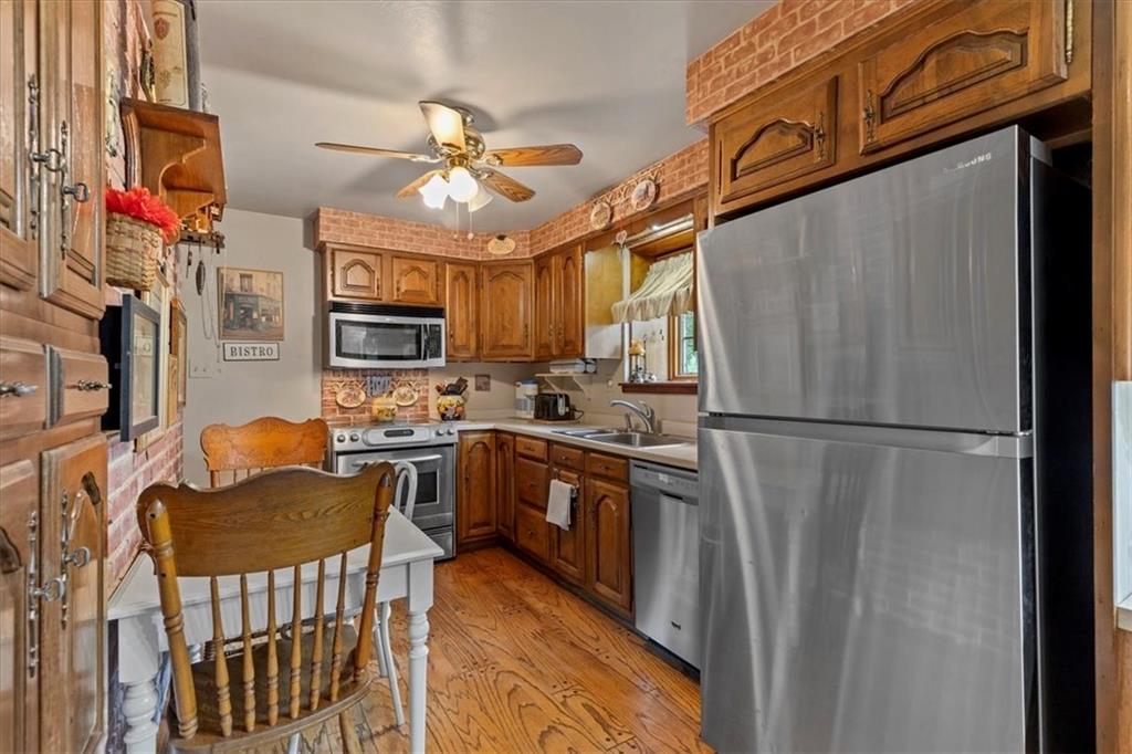 100 Morelli Drive Pittsburgh, PA 15237 - Photo 6 of 46 a kitchen with stainless steel appliances granite countertop a refrigerator a stove top oven a sink and dishwasher