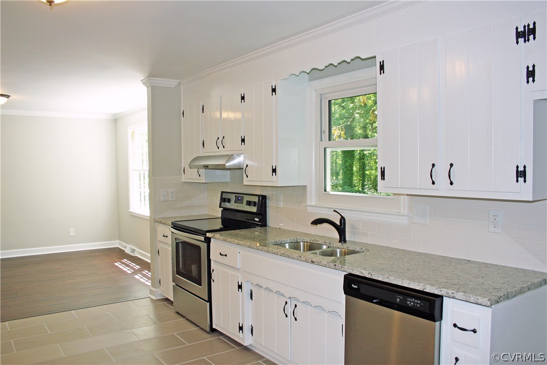 4009 Hidden Valley Road Chester, VA 23831 - Photo 3 of 22 a kitchen with granite countertop a sink stainless steel appliances and cabinets