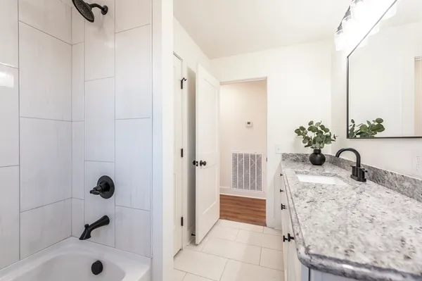 a bathroom with a sink and a shower