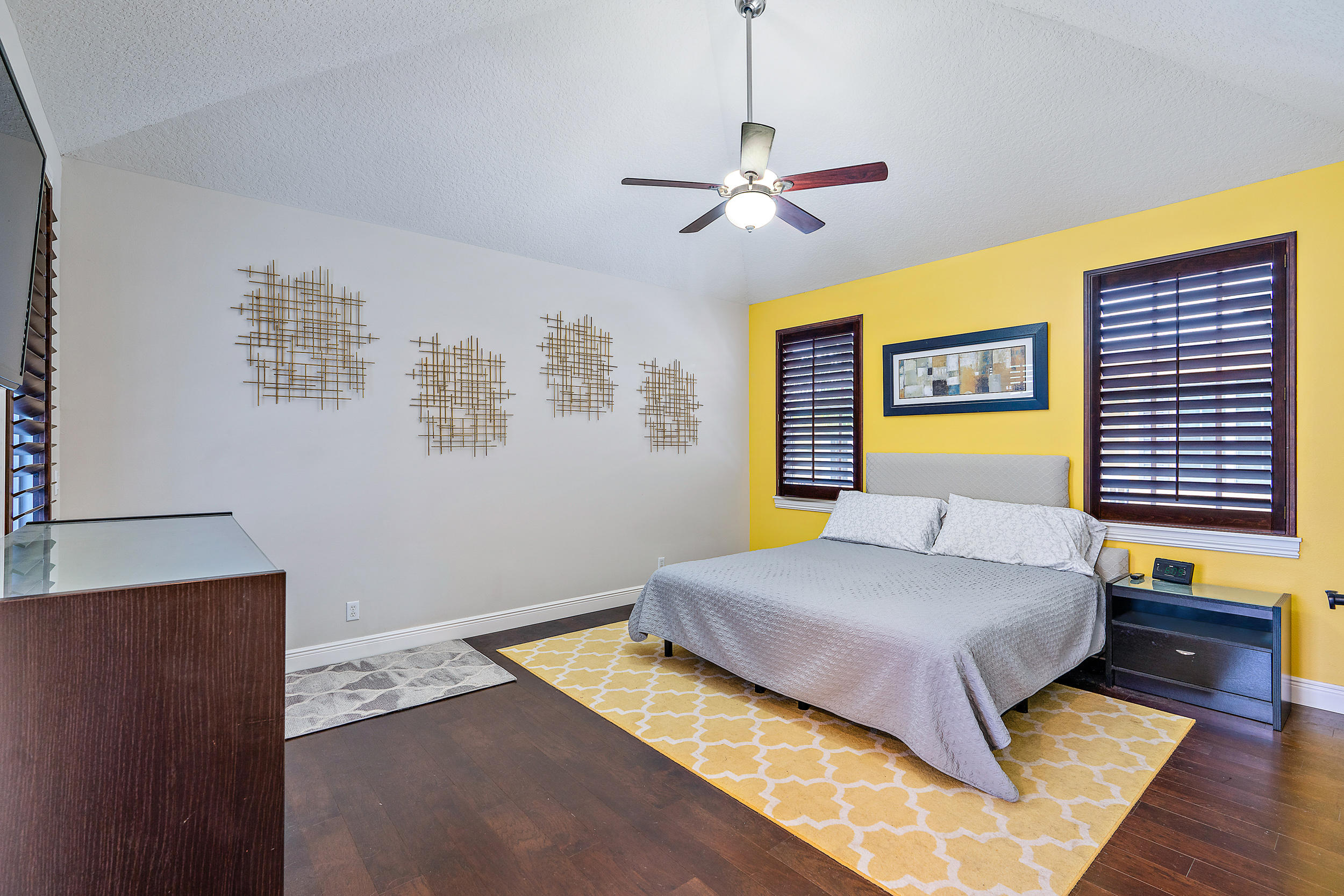 202 Botanica Drive Jupiter, FL 33458 - Photo 17 of 39 a bedroom with a bed and dresser