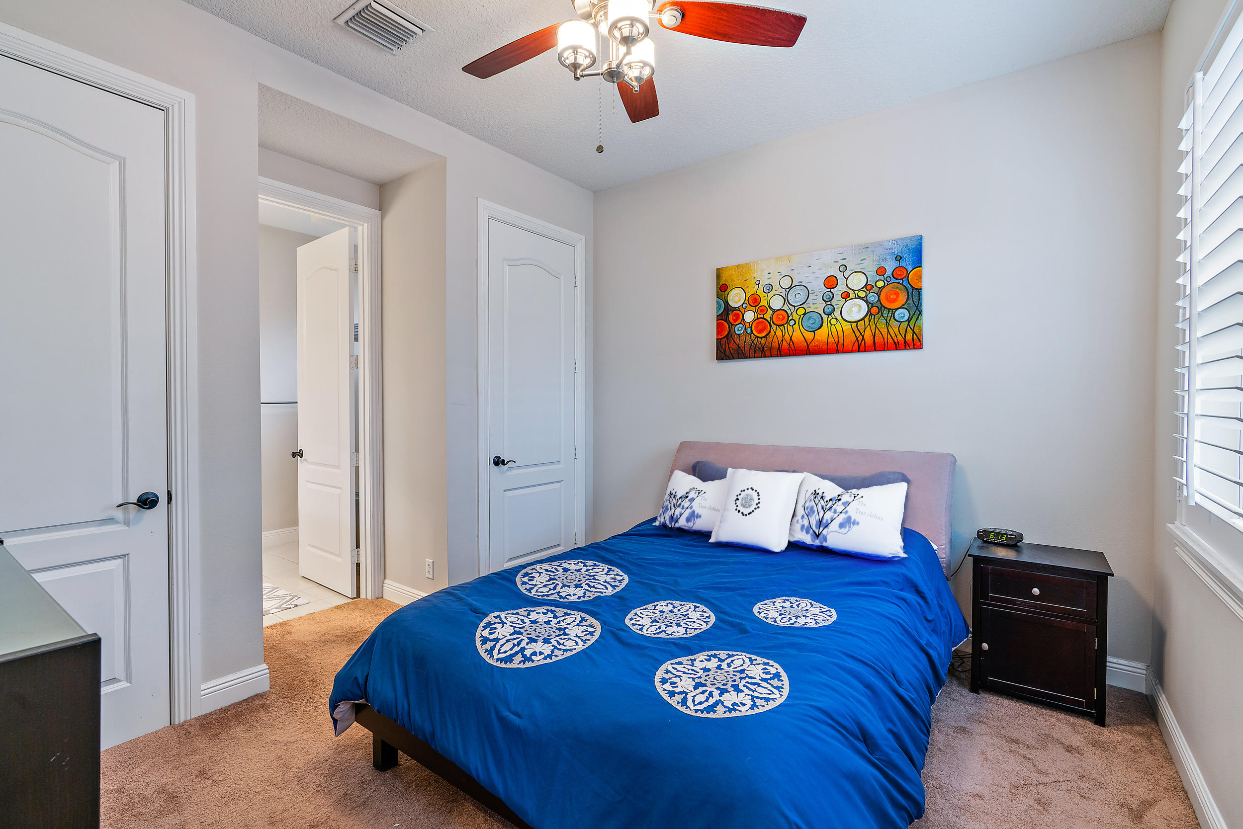 202 Botanica Drive Jupiter, FL 33458 - Photo 24 of 39 a bedroom with a bed and a window