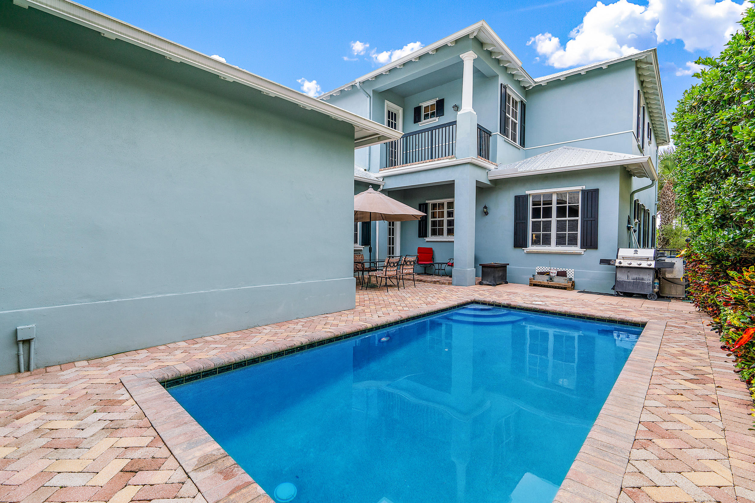 202 Botanica Drive Jupiter, FL 33458 - Photo 27 of 39 a view of a house with pool and chairs
