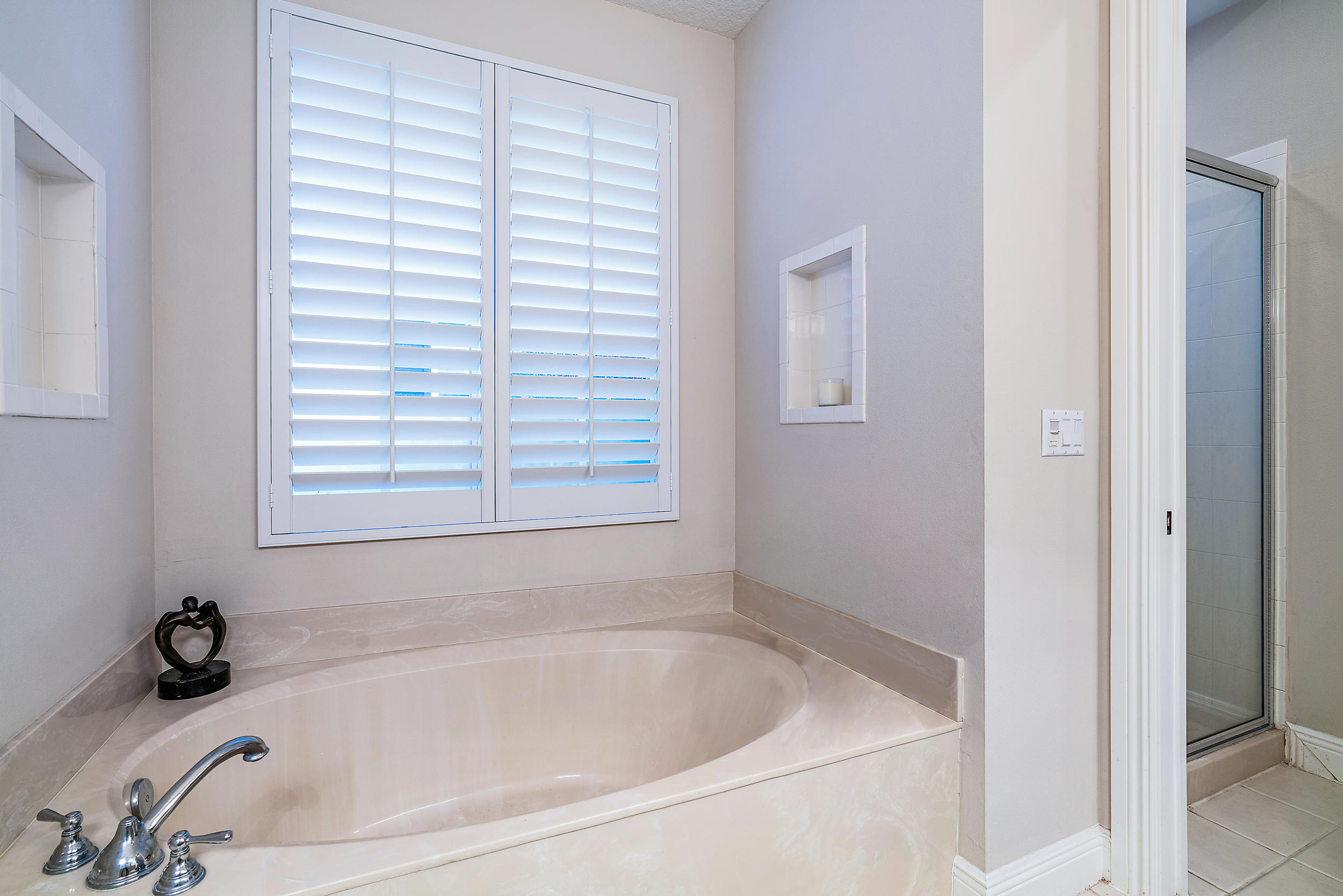 202 Botanica Drive Jupiter, FL 33458 - Photo 31 of 39 a white bath tub sitting next to a window