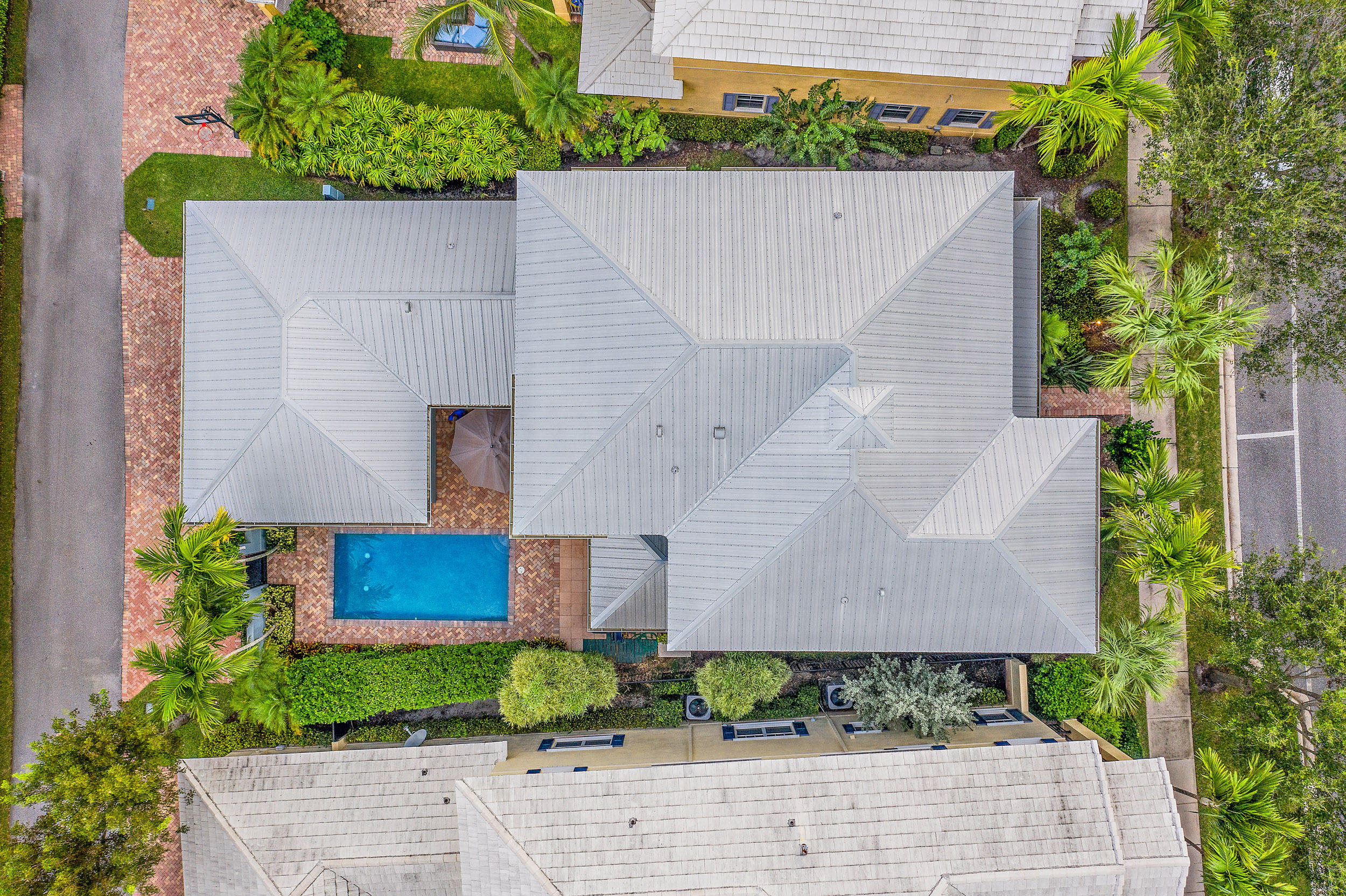 202 Botanica Drive Jupiter, FL 33458 - Photo 36 of 39 front view of a house with a yard