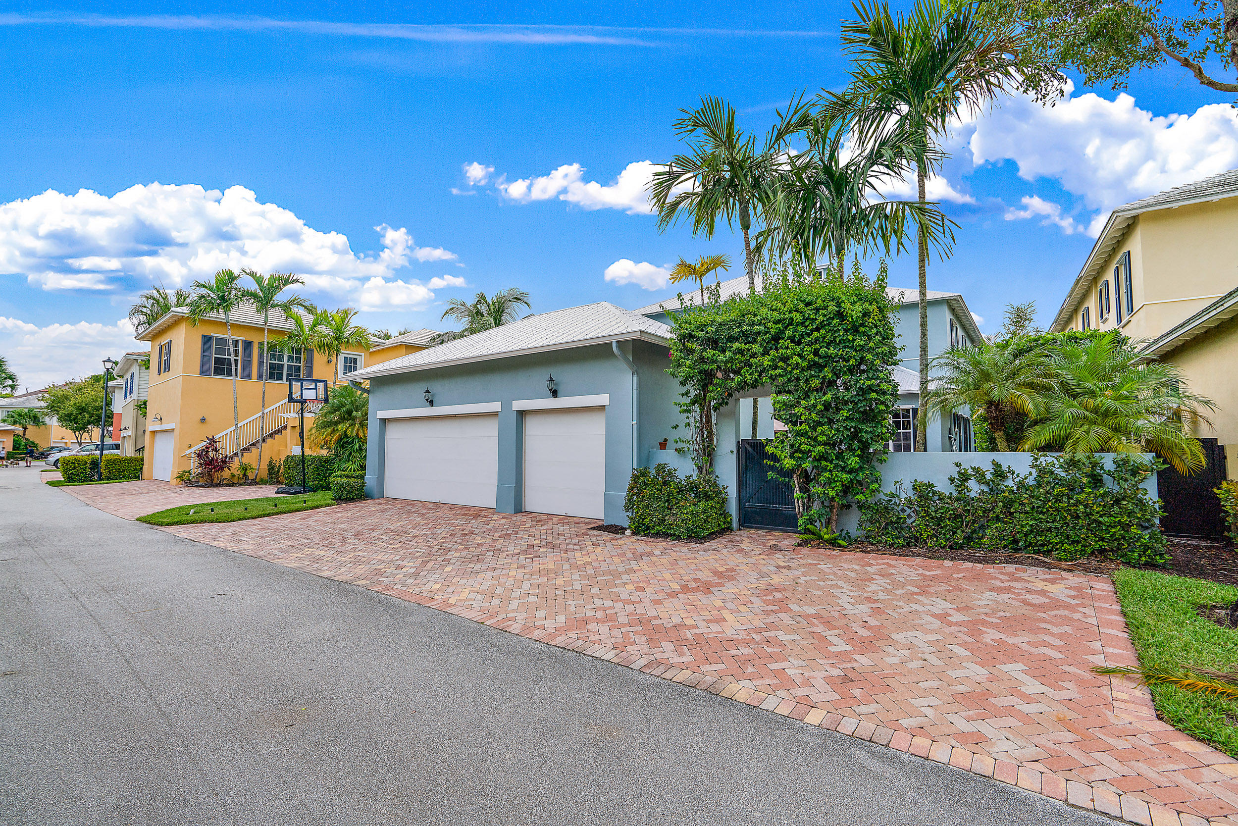 202 Botanica Drive Jupiter, FL 33458 - Photo 39 of 39 a view of a house with a yard and potted plants