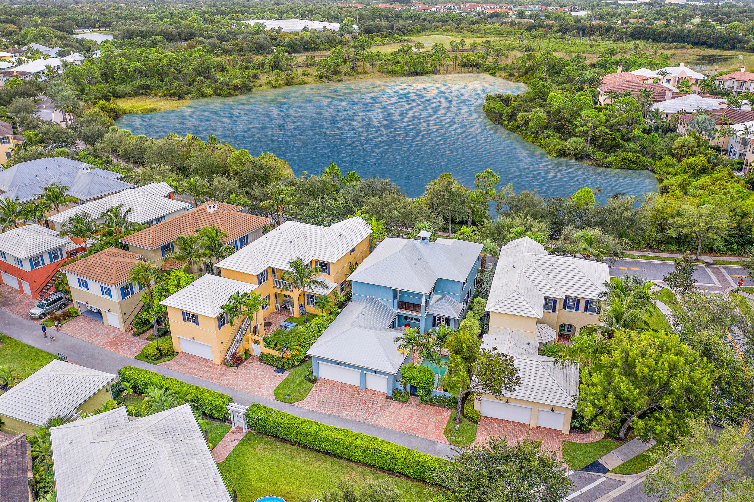 202 Botanica Drive Jupiter, FL 33458 - Photo 5 of 39 an aerial view of lake and residential houses with outdoor space