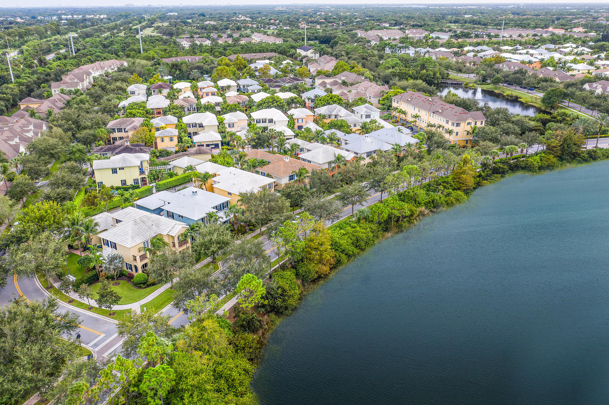 202 Botanica Drive Jupiter, FL 33458 - Photo 6 of 39 an aerial view of a city with lots of residential buildings
