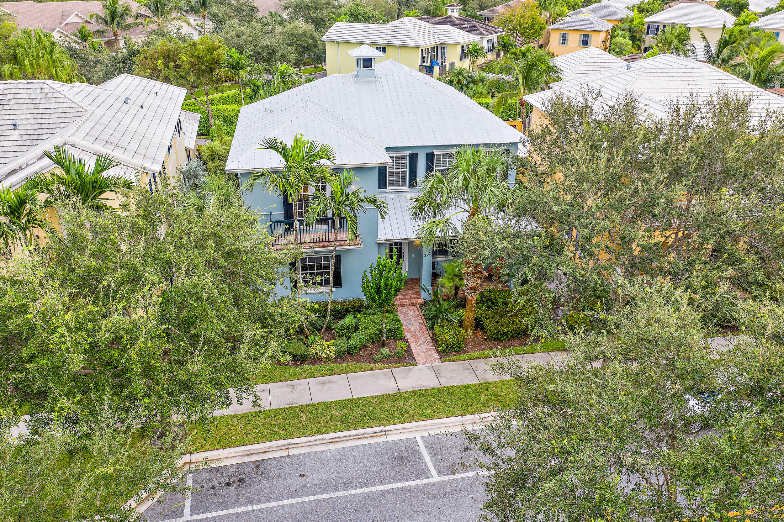202 Botanica Drive Jupiter, FL 33458 - Photo 7 of 39 a view of a yard in front of house