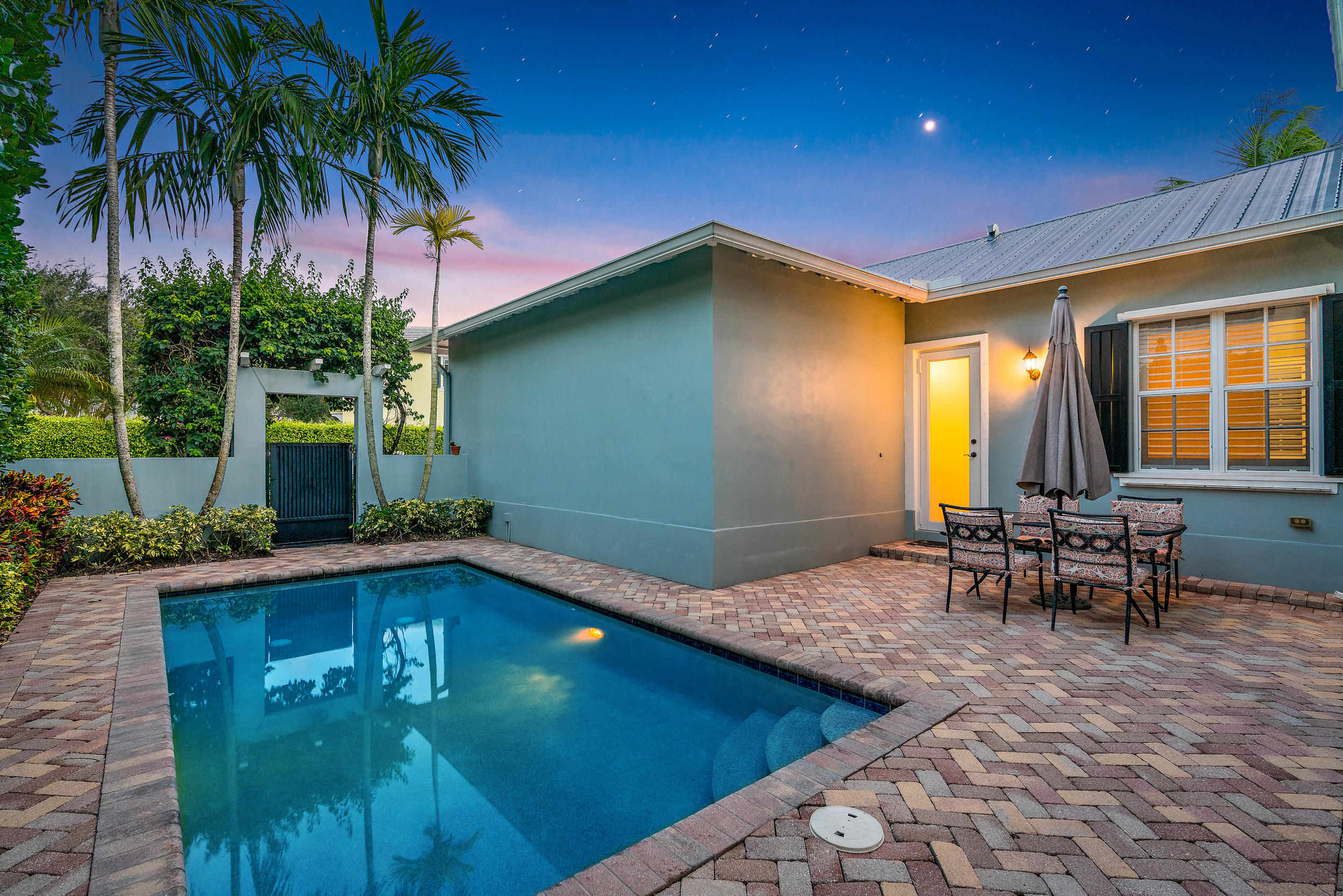 202 Botanica Drive Jupiter, FL 33458 - Photo 8 of 39 a view of a house with backyard porch and patio