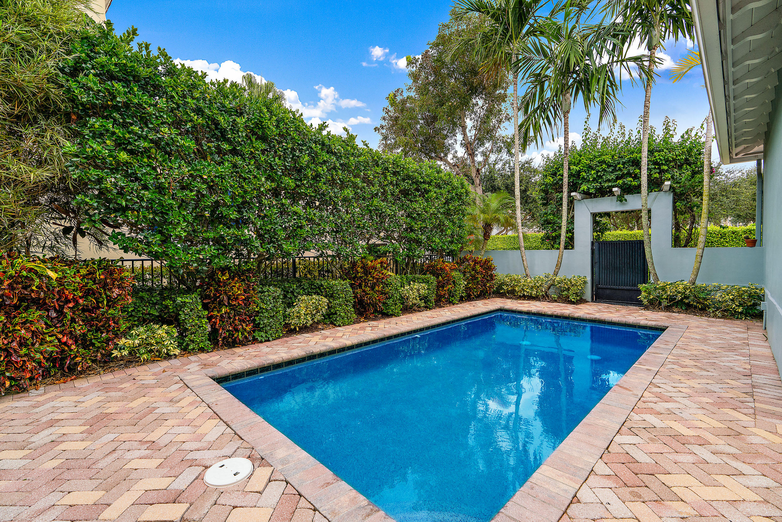 202 Botanica Drive Jupiter, FL 33458 - Photo 9 of 39 a view of swimming pool with a yard