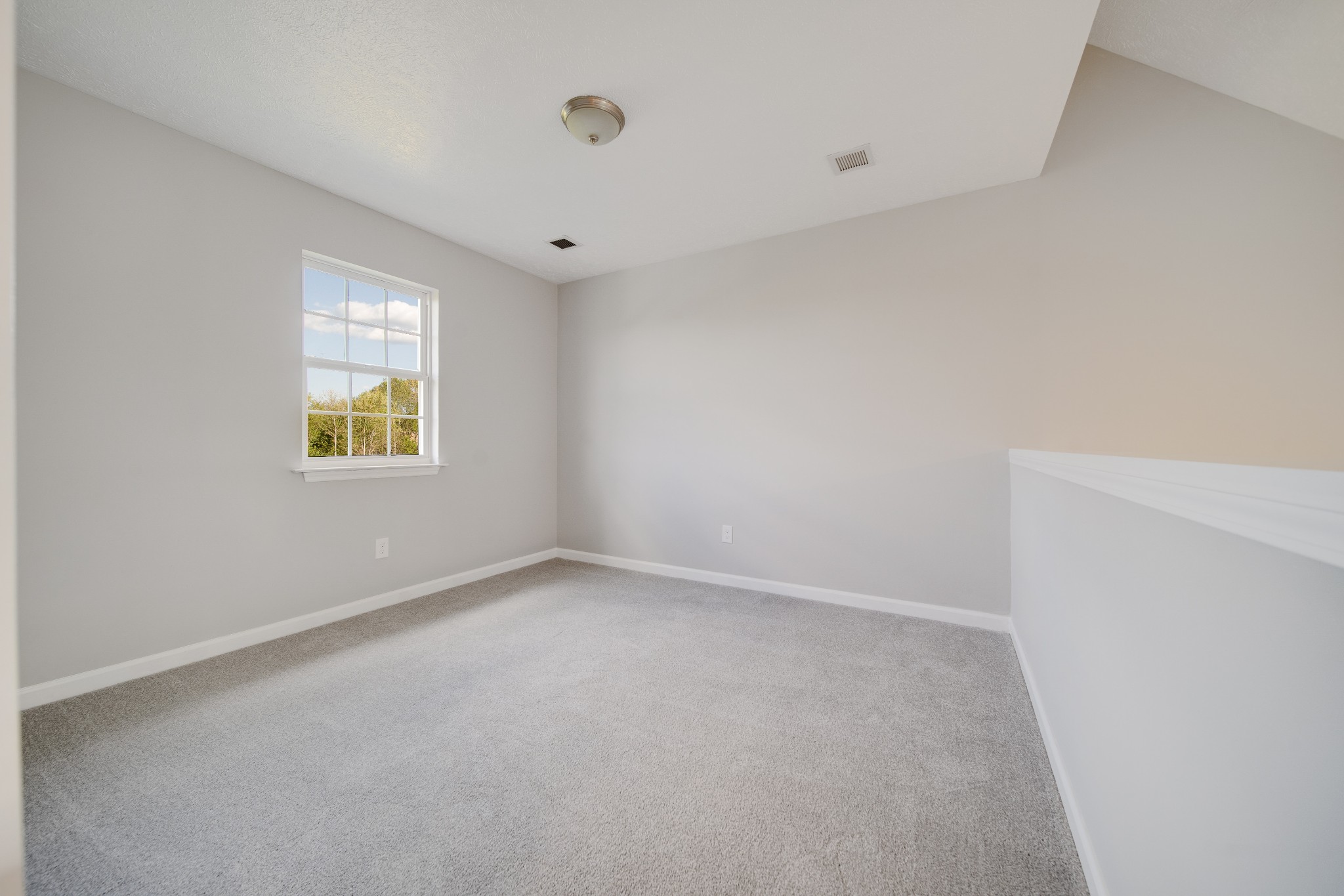 1032 Rock Church Road Dickson, TN 37055 - Photo 19 of 43 a view of an empty room with a window
