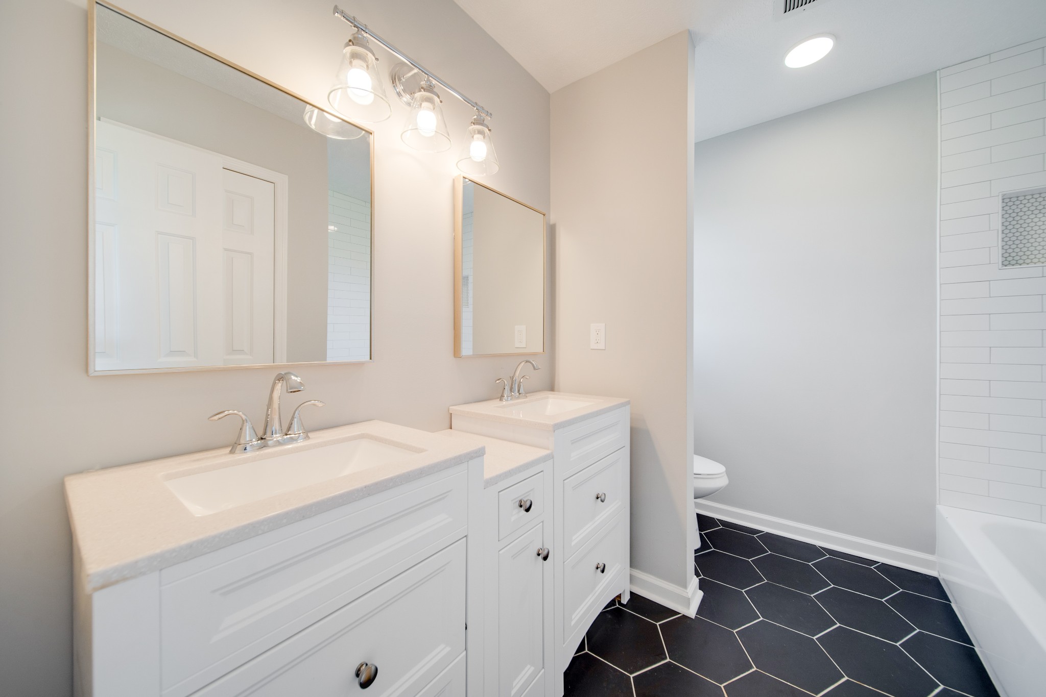 1032 Rock Church Road Dickson, TN 37055 - Photo 22 of 43 a bathroom with a sink a toilet and a mirror