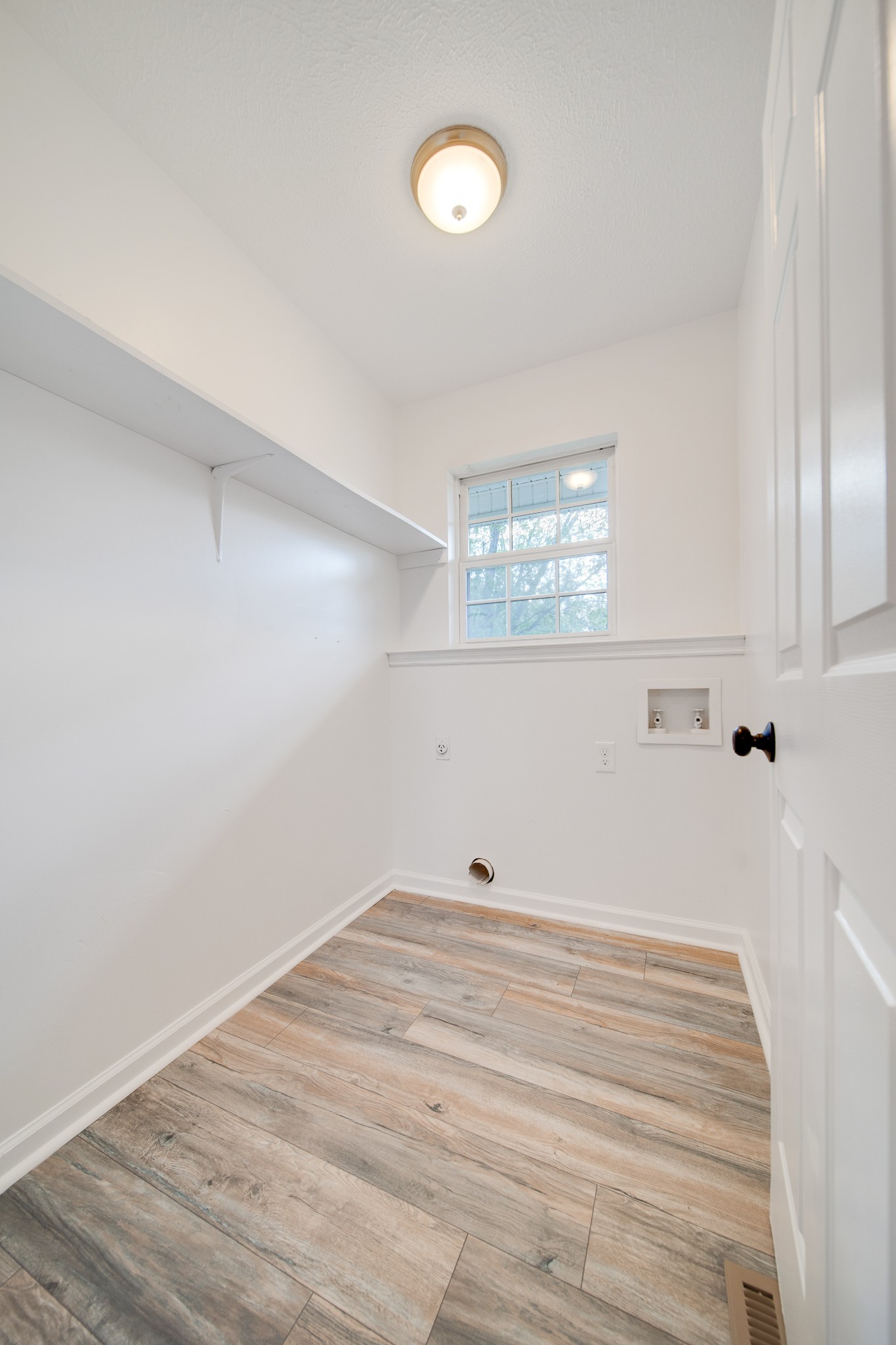 1032 Rock Church Road Dickson, TN 37055 - Photo 27 of 43 a view of a room with wooden floor and fan