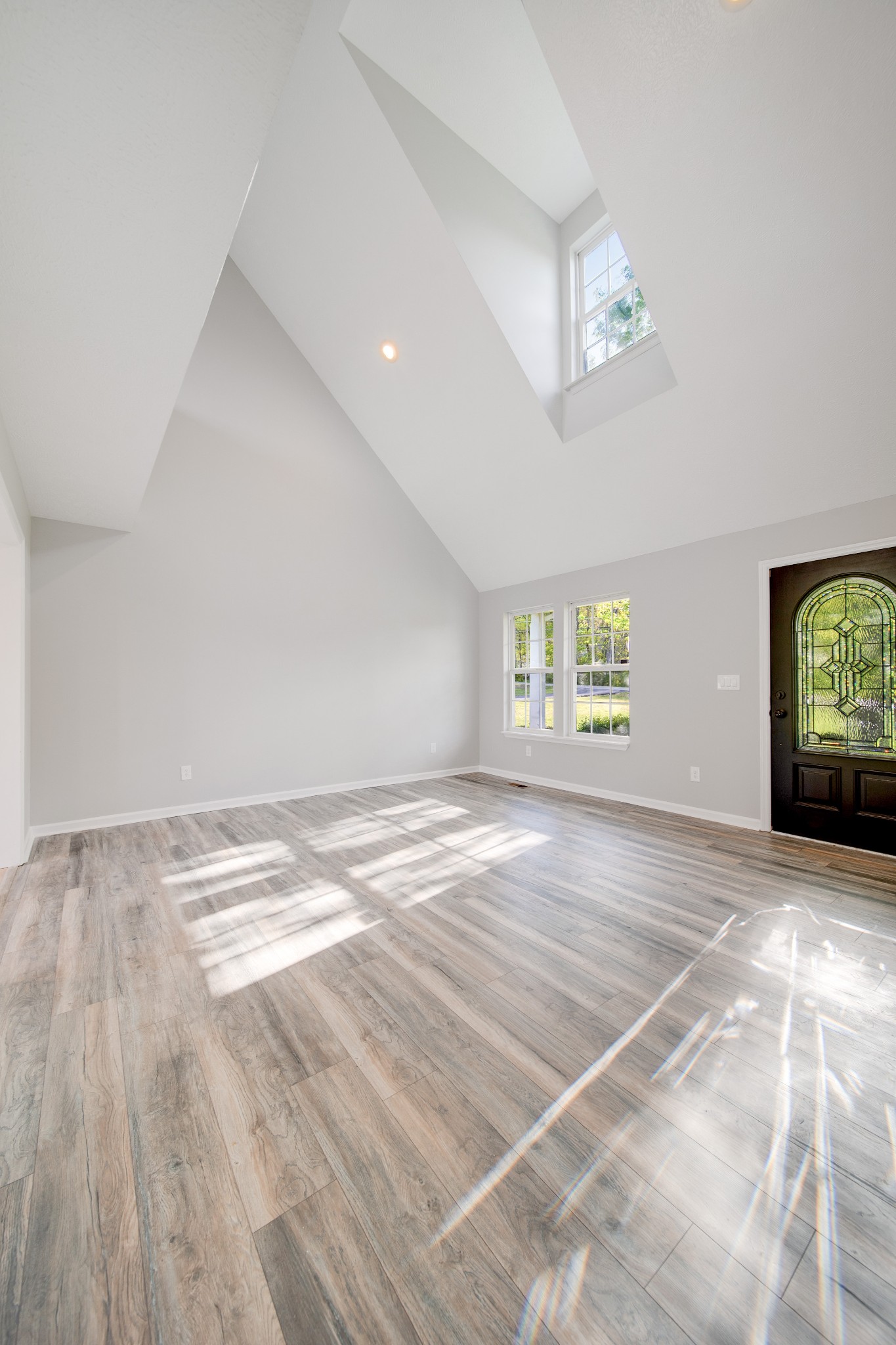 1032 Rock Church Road Dickson, TN 37055 - Photo 6 of 43 an empty room with windows and ceiling fan