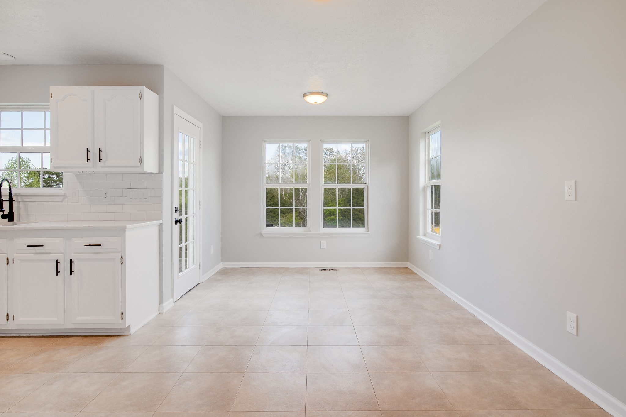 1032 Rock Church Road Dickson, TN 37055 - Photo 8 of 43 an empty room with windows and cabinet