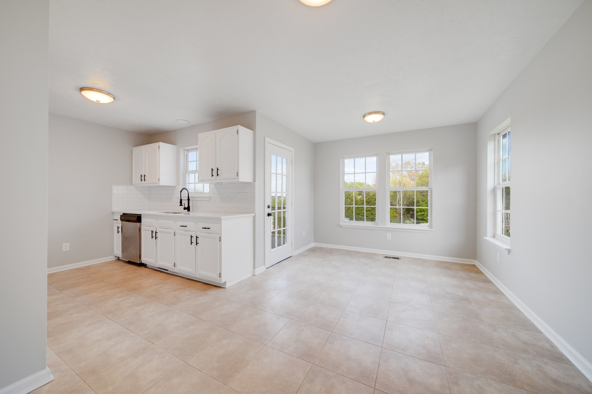 1032 Rock Church Road Dickson, TN 37055 - Photo 9 of 43 a large white kitchen with a large window