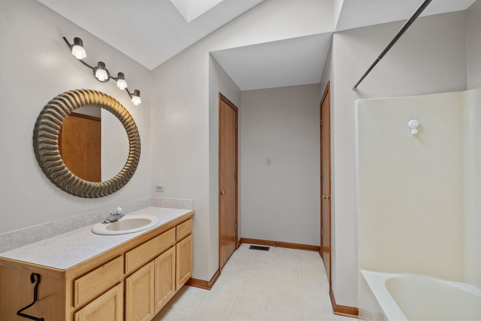 2714 Billie Limacher Lane Plainfield, IL 60586 - Photo 15 of 26 a bathroom with a sink and a mirror