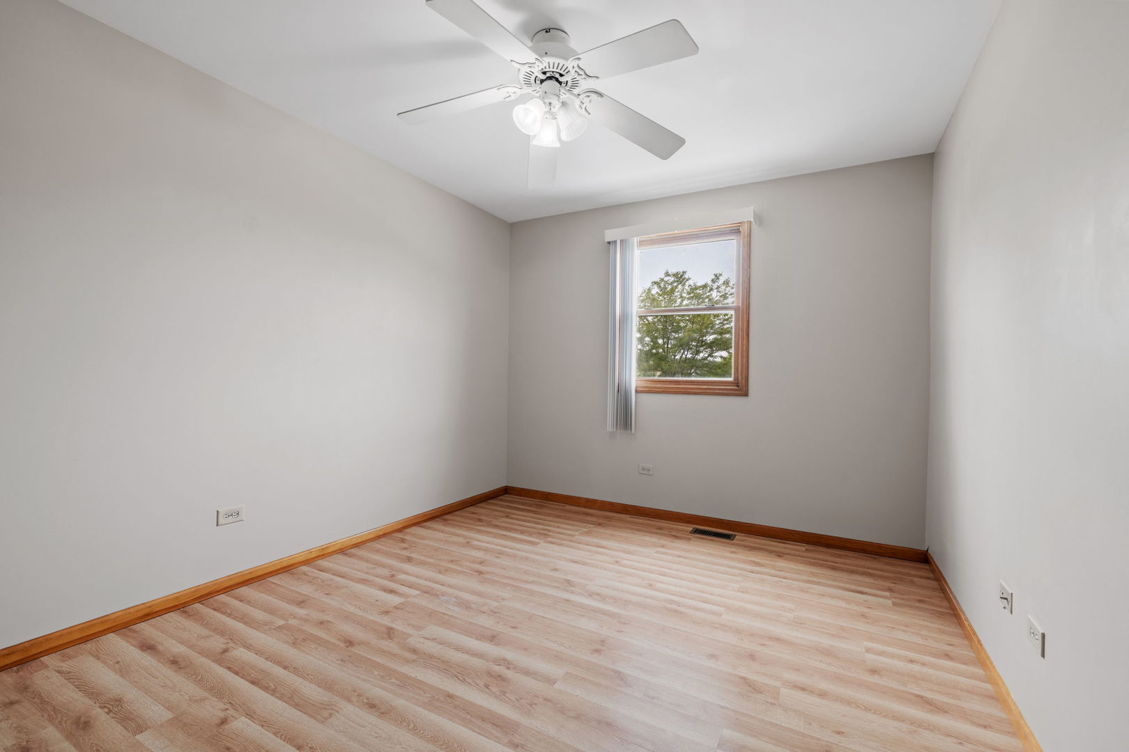 2714 Billie Limacher Lane Plainfield, IL 60586 - Photo 18 of 26 wooden floor in an empty room with a window