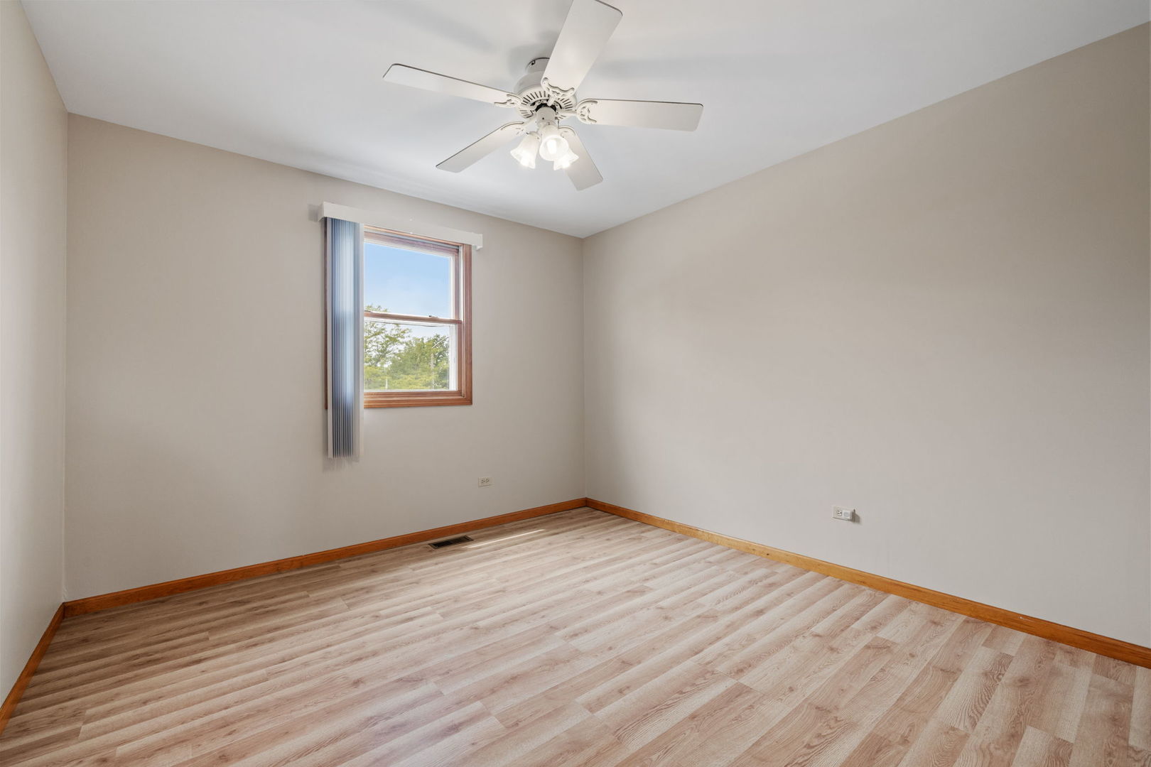 2714 Billie Limacher Lane Plainfield, IL 60586 - Photo 19 of 26 wooden floor in an empty room with a window