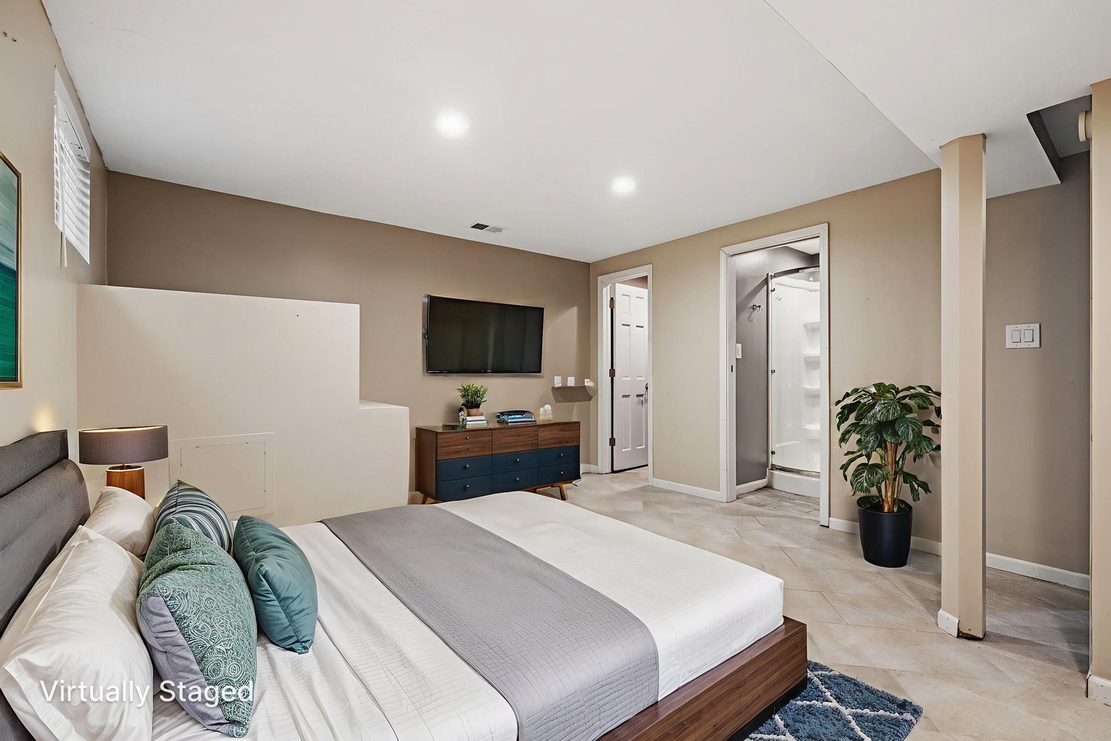 2714 Billie Limacher Lane Plainfield, IL 60586 - Photo 20 of 26 a bedroom with a bed and a flat screen tv