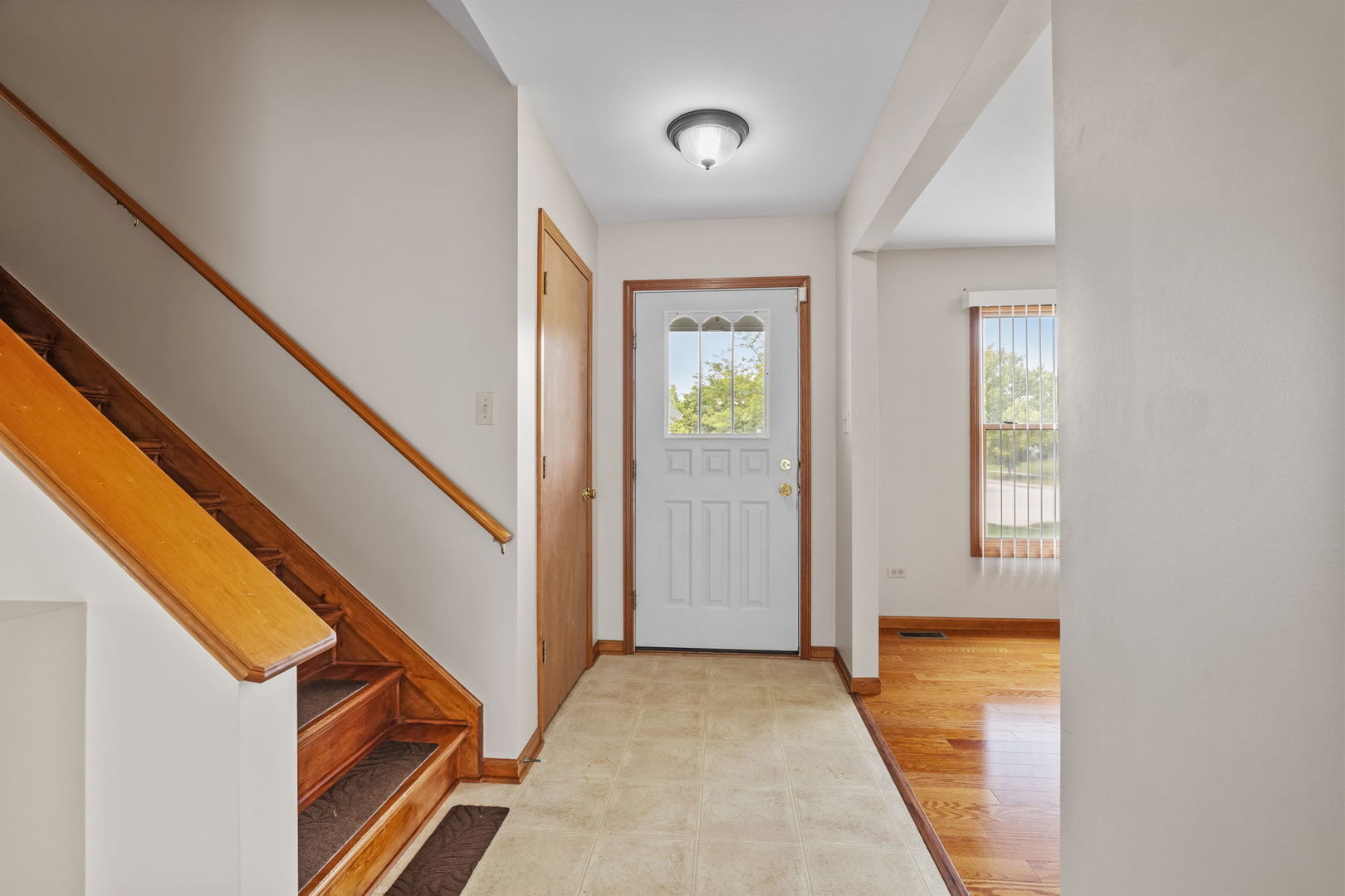 2714 Billie Limacher Lane Plainfield, IL 60586 - Photo 2 of 26 wooden floor in an empty room with a window