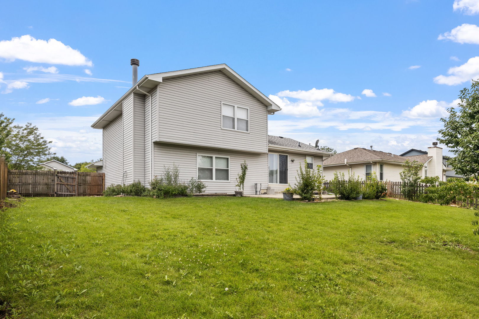 2714 Billie Limacher Lane Plainfield, IL 60586 - Photo 26 of 26 a view of a house with a yard