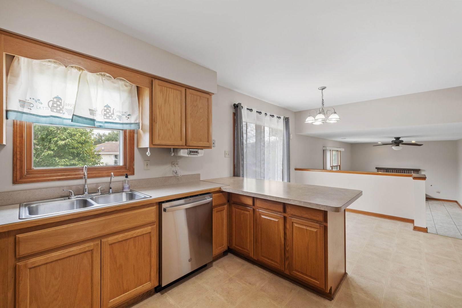 2714 Billie Limacher Lane Plainfield, IL 60586 - Photo 8 of 26 a kitchen with a sink stove and window