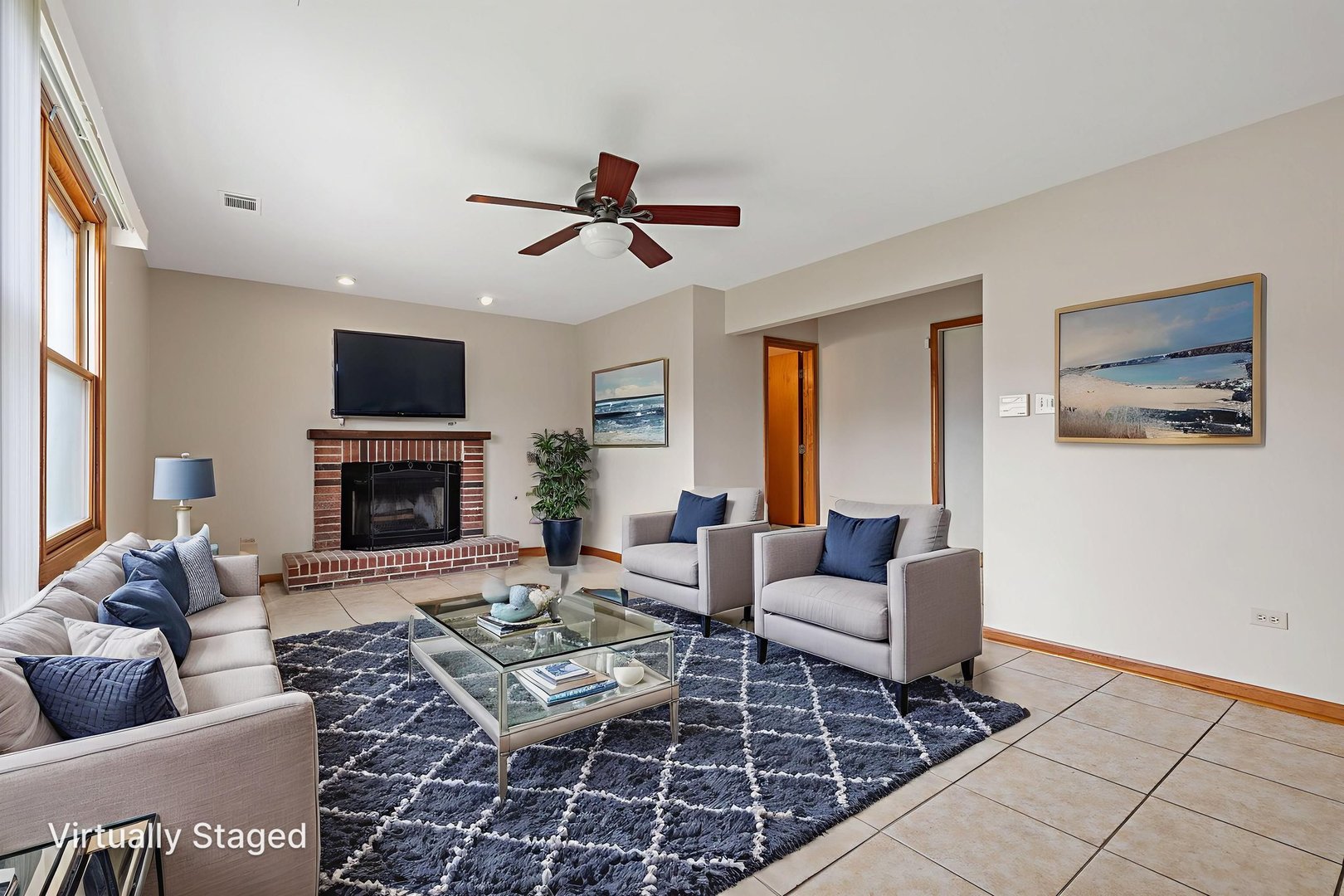 2714 Billie Limacher Lane Plainfield, IL 60586 - Photo 9 of 26 a living room with furniture a flat screen tv and a fireplace