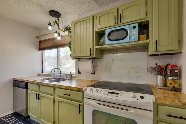 a kitchen with a sink and cabinets