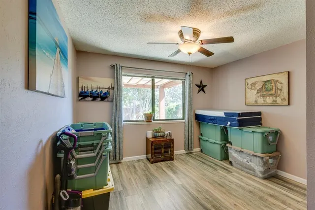 a bathroom with a sink vanity mirror and toilet
