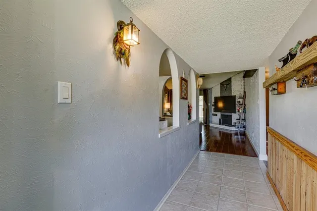 a view of hallway with livingroom