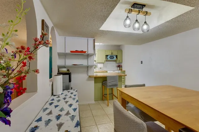 a utility room with cabinets washer and dryer