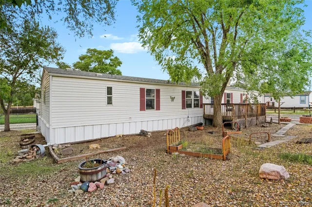 a backyard of a house with seating space