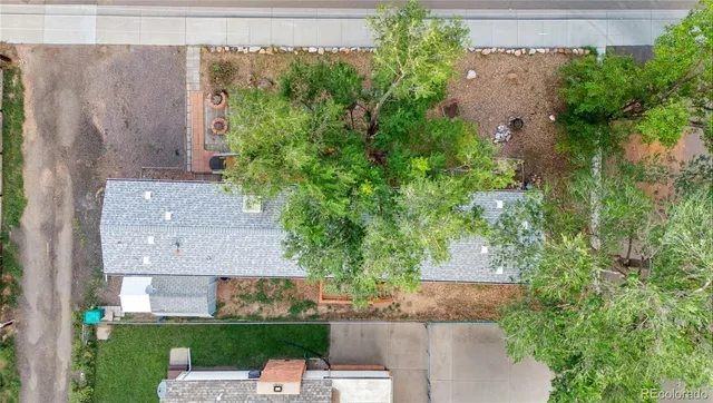 an aerial view of a house with a yard and garden