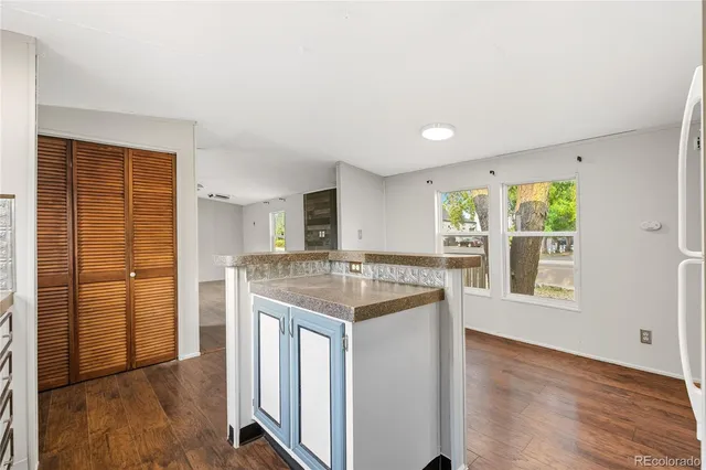 a kitchen with stainless steel appliances granite countertop a stove and a refrigerator