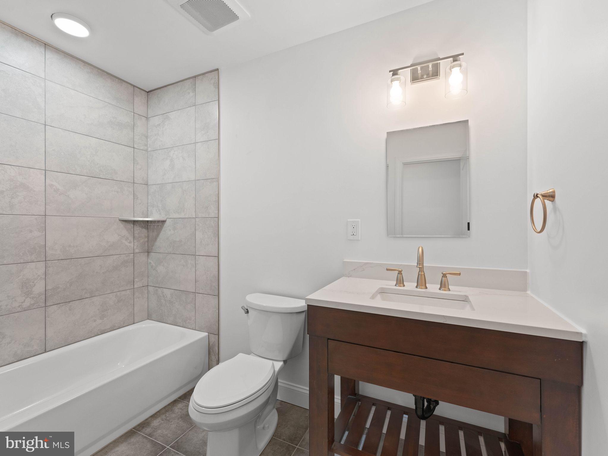 617 Caribbean Way Williamstown, NJ 08094 - Photo 19 of 26 a bathroom with a sink a toilet and shower