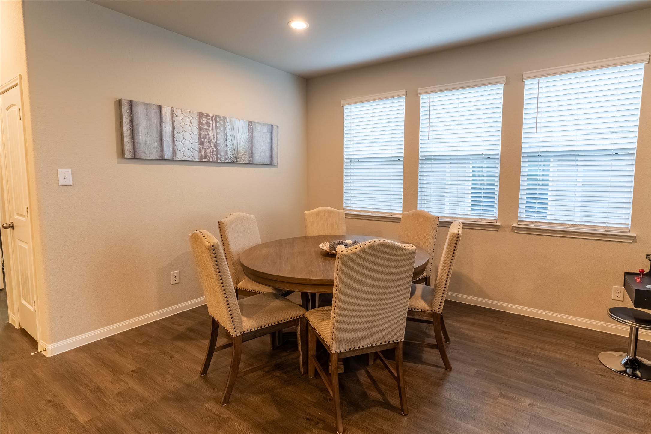 2512 Austin Hills Conroe, TX 77304 - Photo 13 of 43 a view of a dining room with furniture and wooden floor