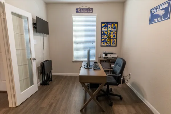 a view of a dining room with furniture and wooden floor