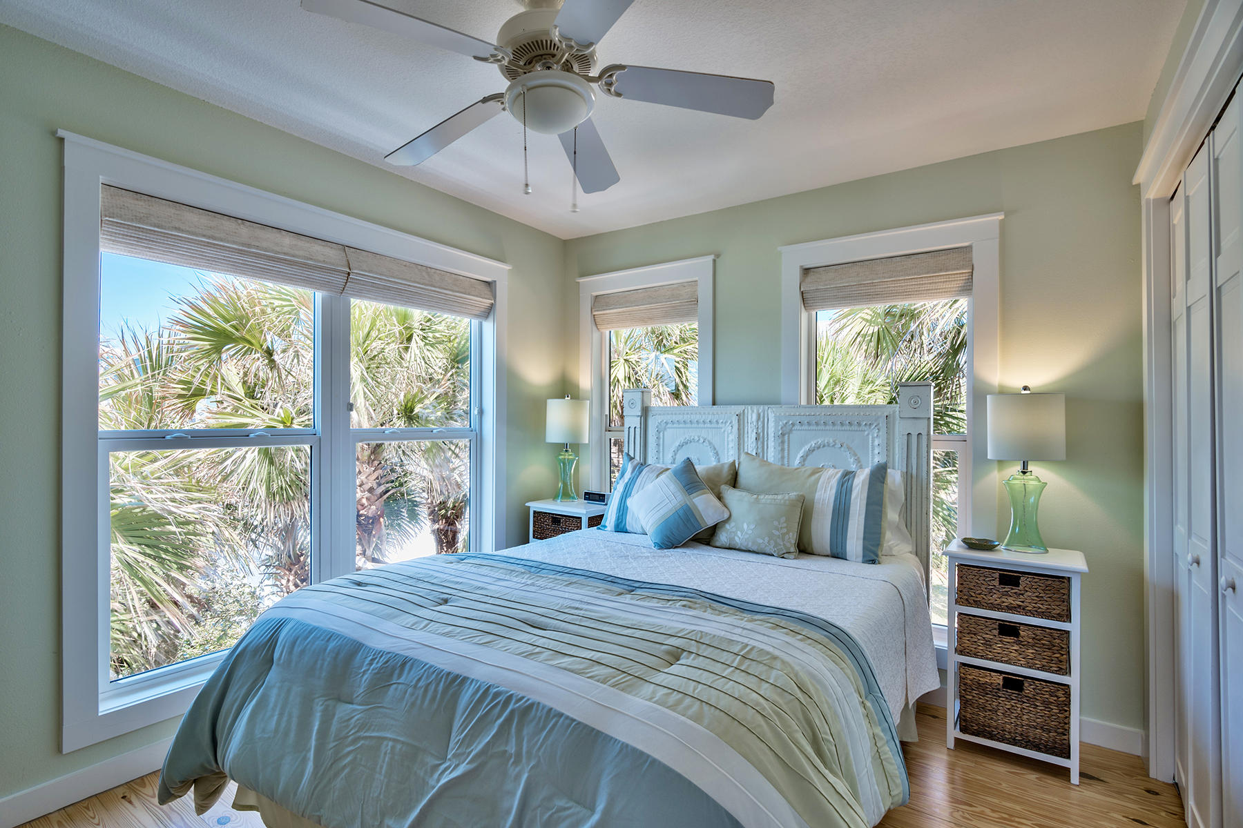 637 Eastern Lake Road Santa Rosa Beach, FL 32459 - Photo 13 of 25 a bedroom with a large bed and a chandelier