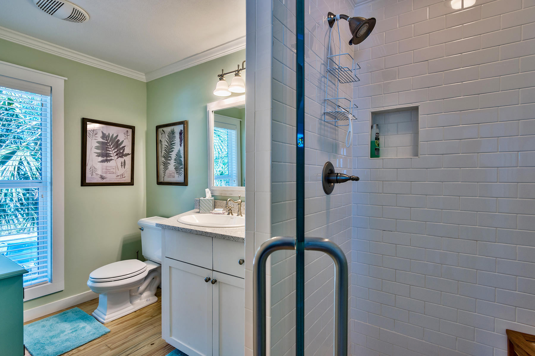637 Eastern Lake Road Santa Rosa Beach, FL 32459 - Photo 14 of 25 a bathroom with a toilet a sink and mirror
