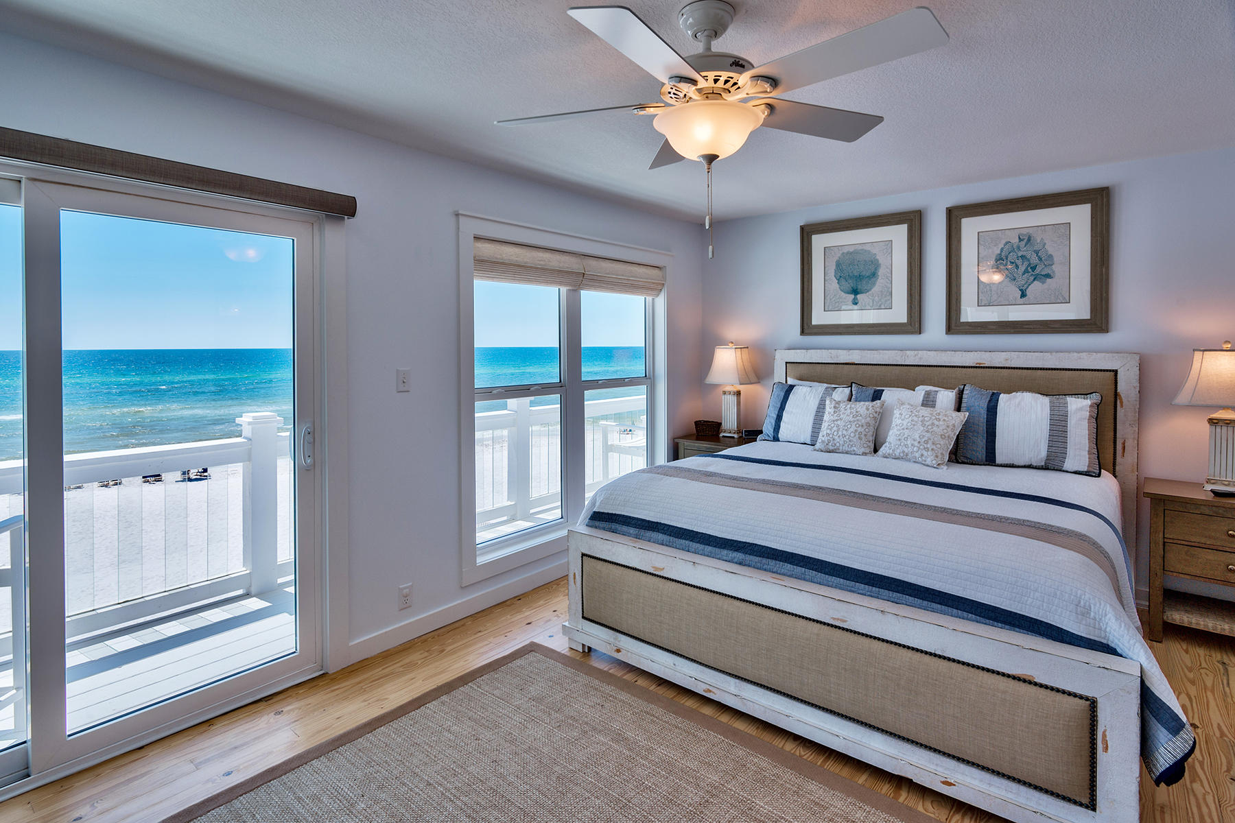 637 Eastern Lake Road Santa Rosa Beach, FL 32459 - Photo 15 of 25 a bedroom with a large bed and a chandelier