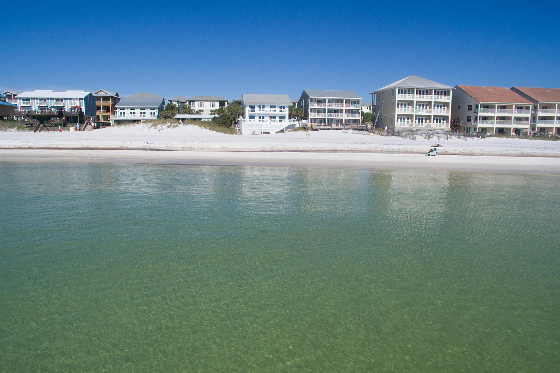 637 Eastern Lake Road Santa Rosa Beach, FL 32459 - Photo 24 of 25 a view of a lake with building in front of it