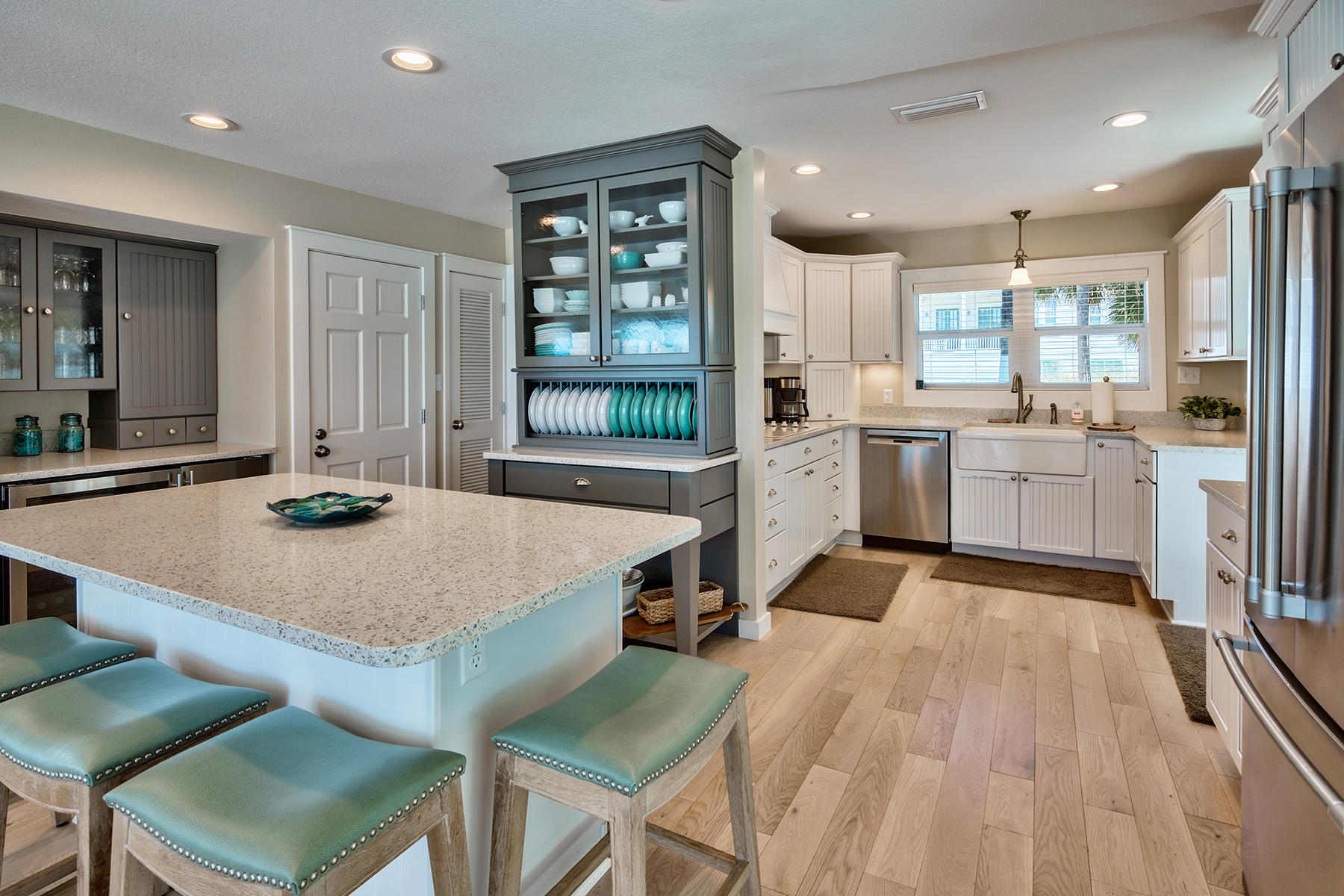 637 Eastern Lake Road Santa Rosa Beach, FL 32459 - Photo 8 of 25 a large kitchen with kitchen island a stove a table and chairs in it