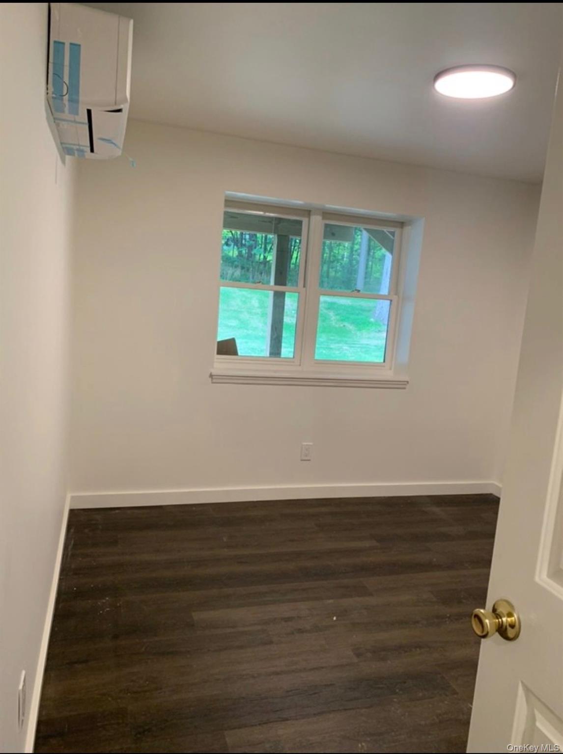 35 Old Rte 199 Red Hook, NY 12571 - Photo 4 of 10 a view of an empty room with wooden floor and a window