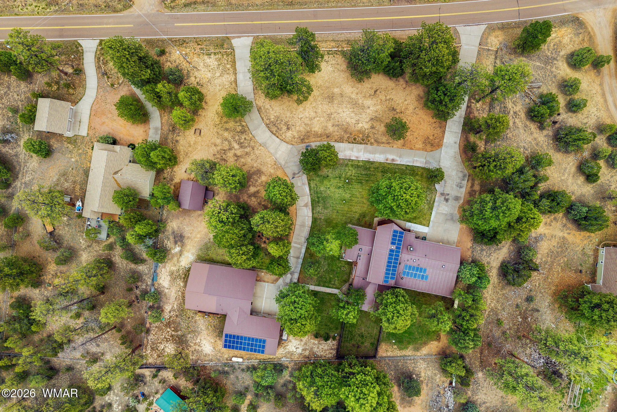 2922 Pine Rim Road Overgaard, AZ 85933 - Photo 49 of 58 an aerial view of a house with a garden and yard