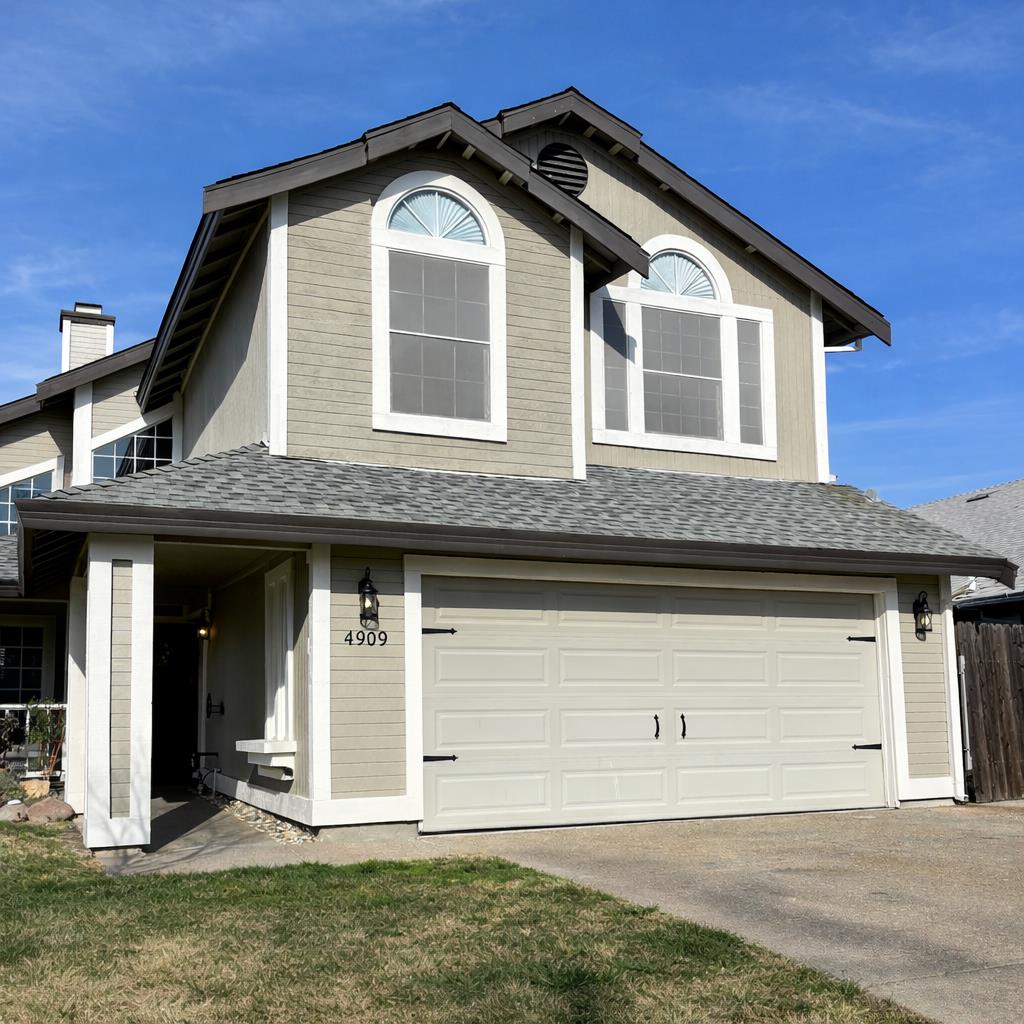 4909 Hidden Meadow Way Antelope, CA 95843 - Photo 2 of 35 a front view of a house with a yard