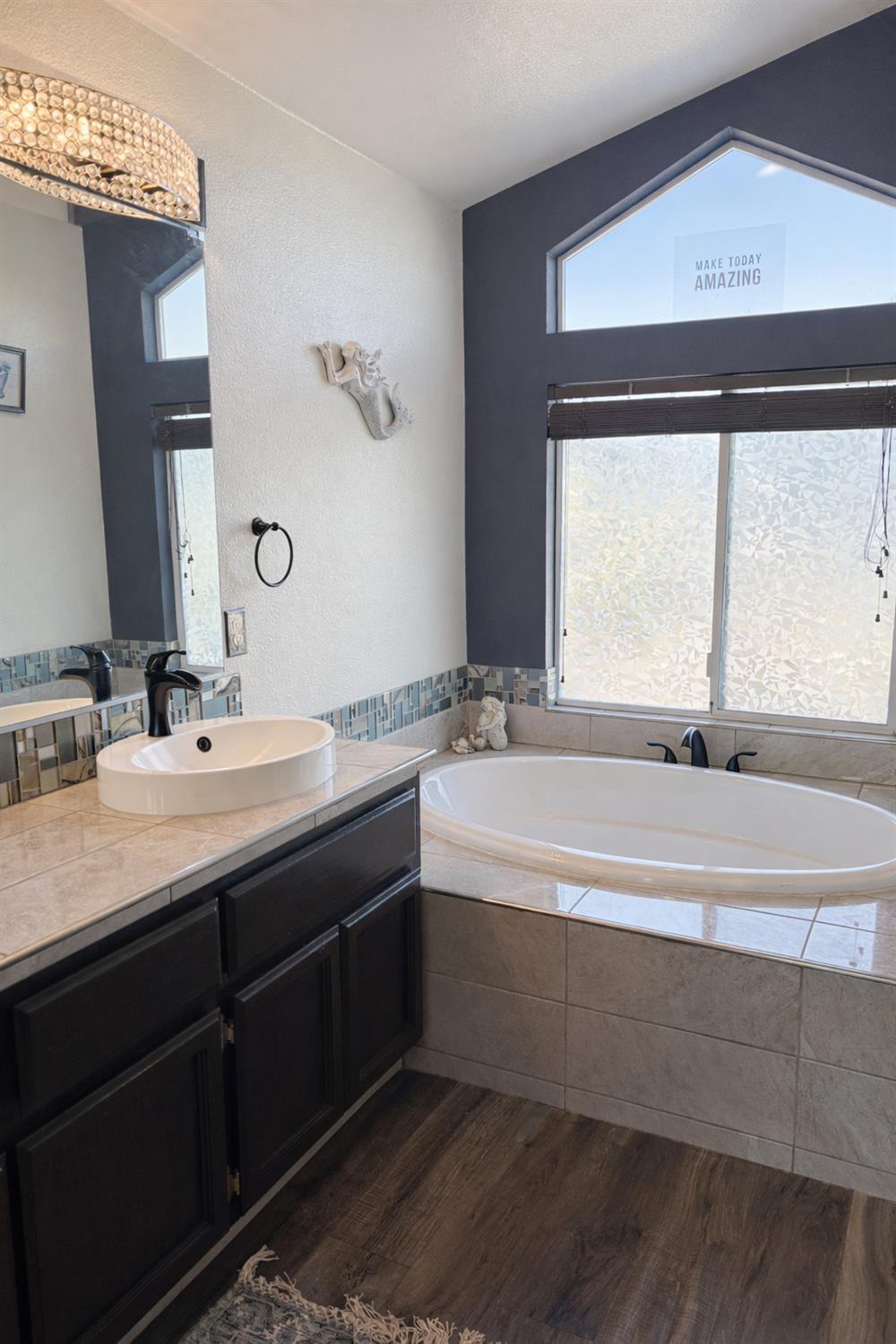 4909 Hidden Meadow Way Antelope, CA 95843 - Photo 27 of 35 a bathroom with a bathtub and a sink