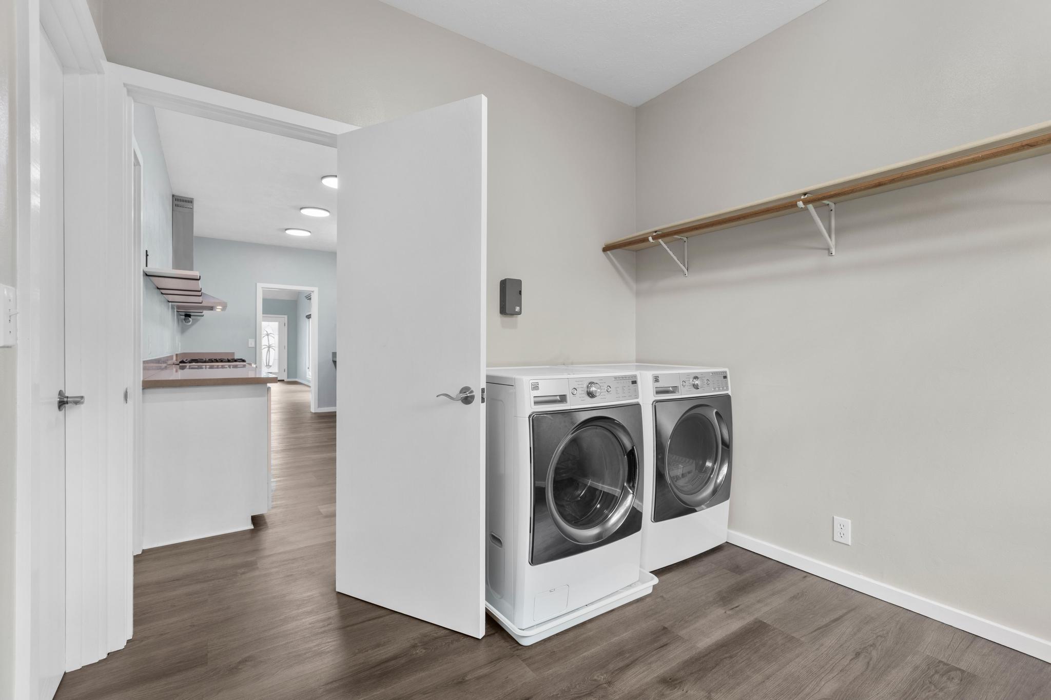 234 Kipa Street Hilo, HI 96720 - Photo 29 of 30 a view of washer and dryer with wooden floor