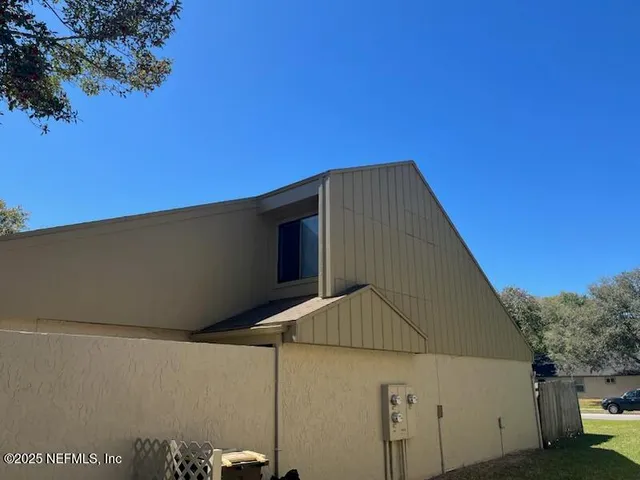 a backyard of a house with lots of green space