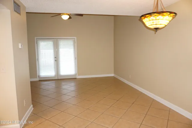 an empty room with a empty space and a window